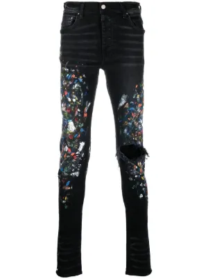 AMIRI paint print distressed skinny jeans