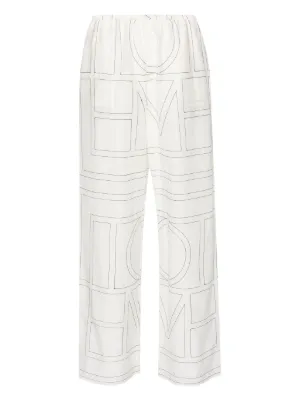 TOTEME embroidered-monogram trousers