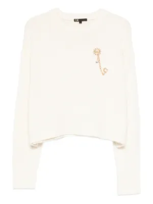 Maje jumper with floral brooch