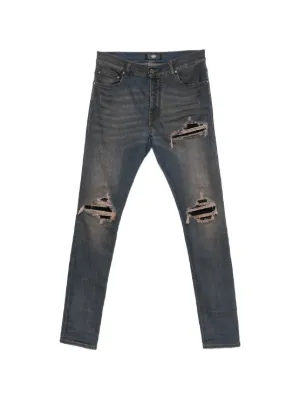 AMIRI Ultrasuede MX1 distressed slim-fit jeans